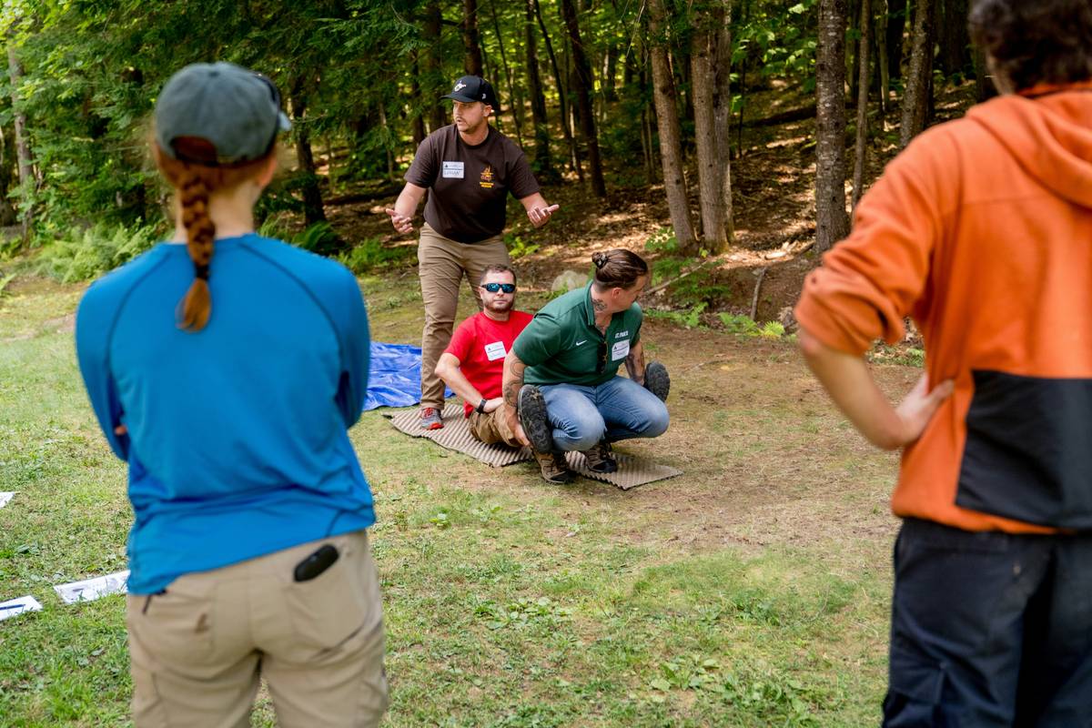 outdoor guide training demonstration using natural obstacles for strength exercises